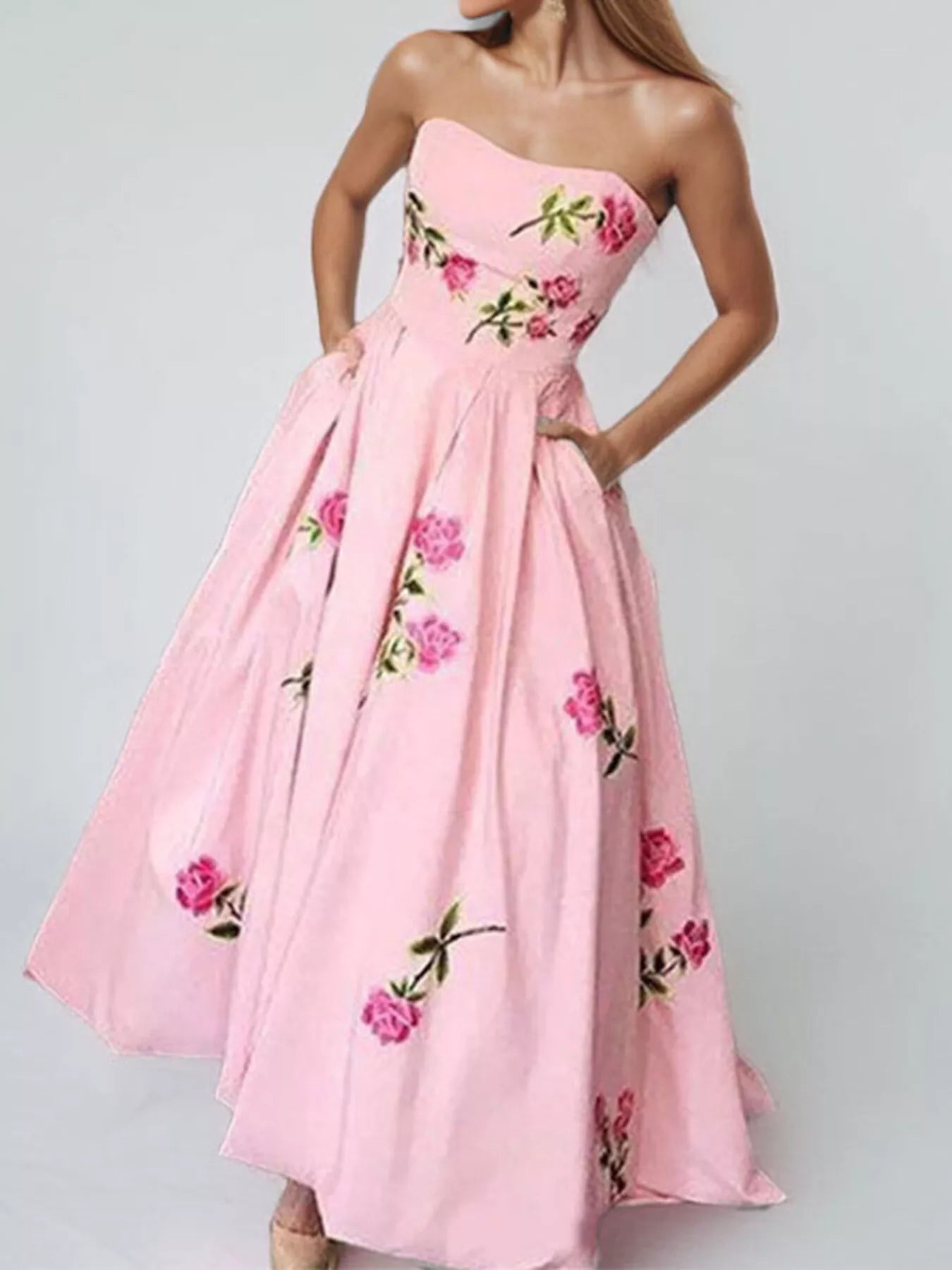 Floral print tube maxi dress from Trendsi featuring a fitted bodice and flowing skirt with vibrant floral patterns.