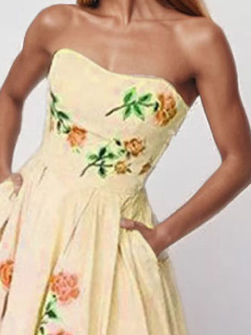 Floral print tube maxi dress from Trendsi featuring a fitted bodice, flowing skirt, and vibrant floral pattern.