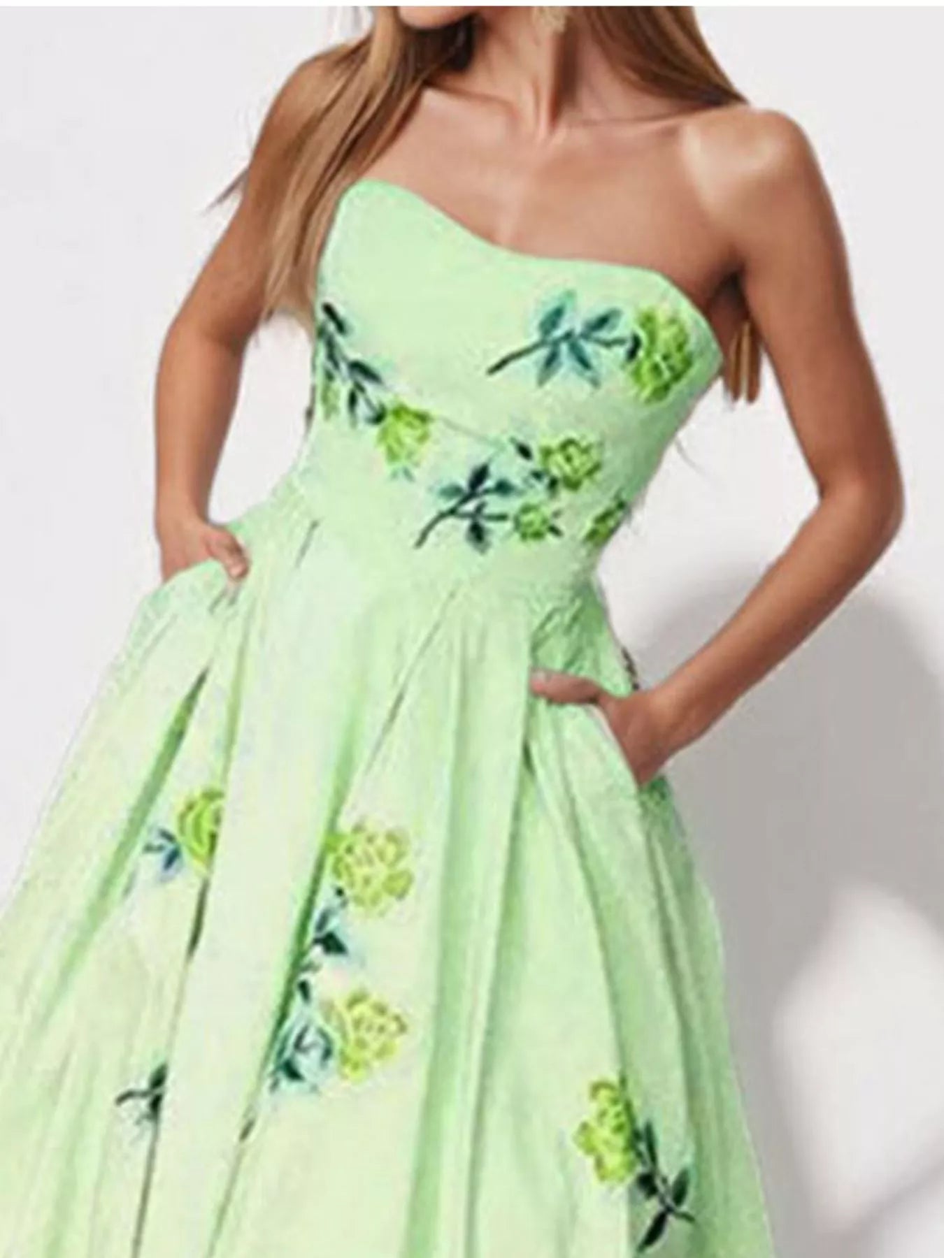 Floral print tube maxi dress from Trendsi featuring a fitted bodice and flowing skirt in vibrant floral patterns.