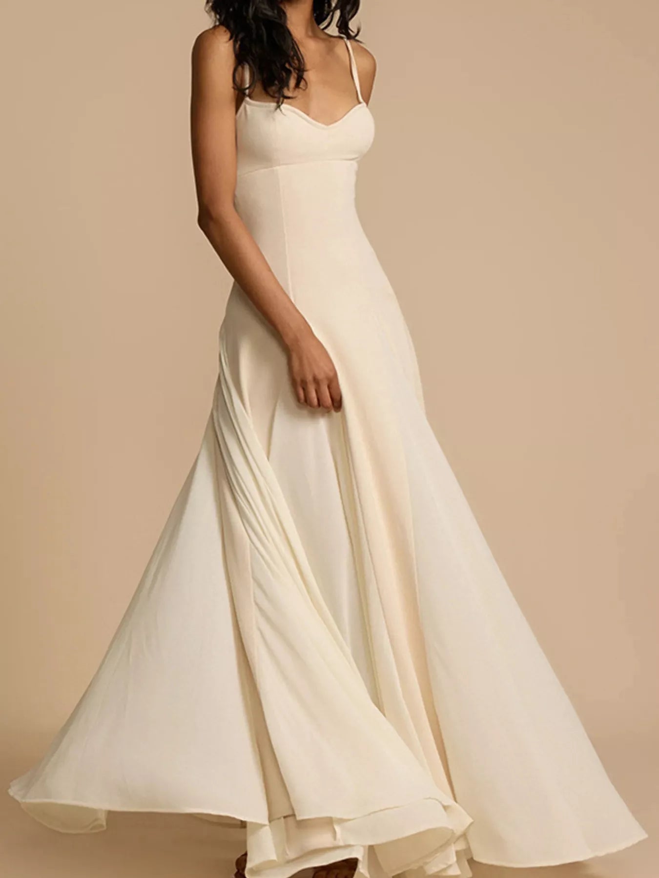 Sweetheart neck spaghetti strap flowy maxi dress by Trendsi with a lightweight, elegant design and a flattering fit.