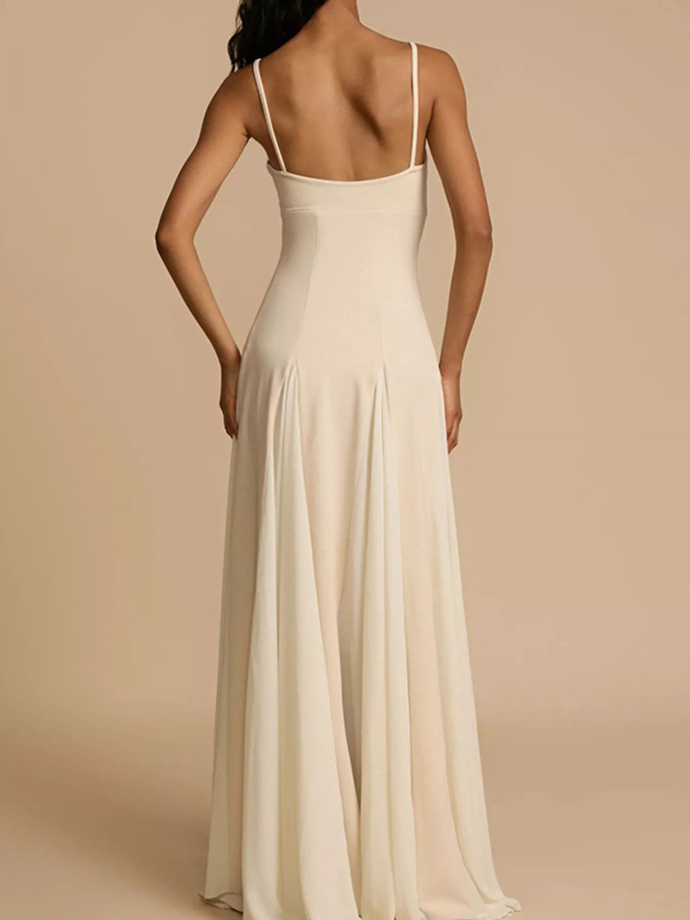 Flowy sweetheart neck spaghetti strap maxi dress by Trendsi, featuring a feminine design with a flowing silhouette and elegant details.