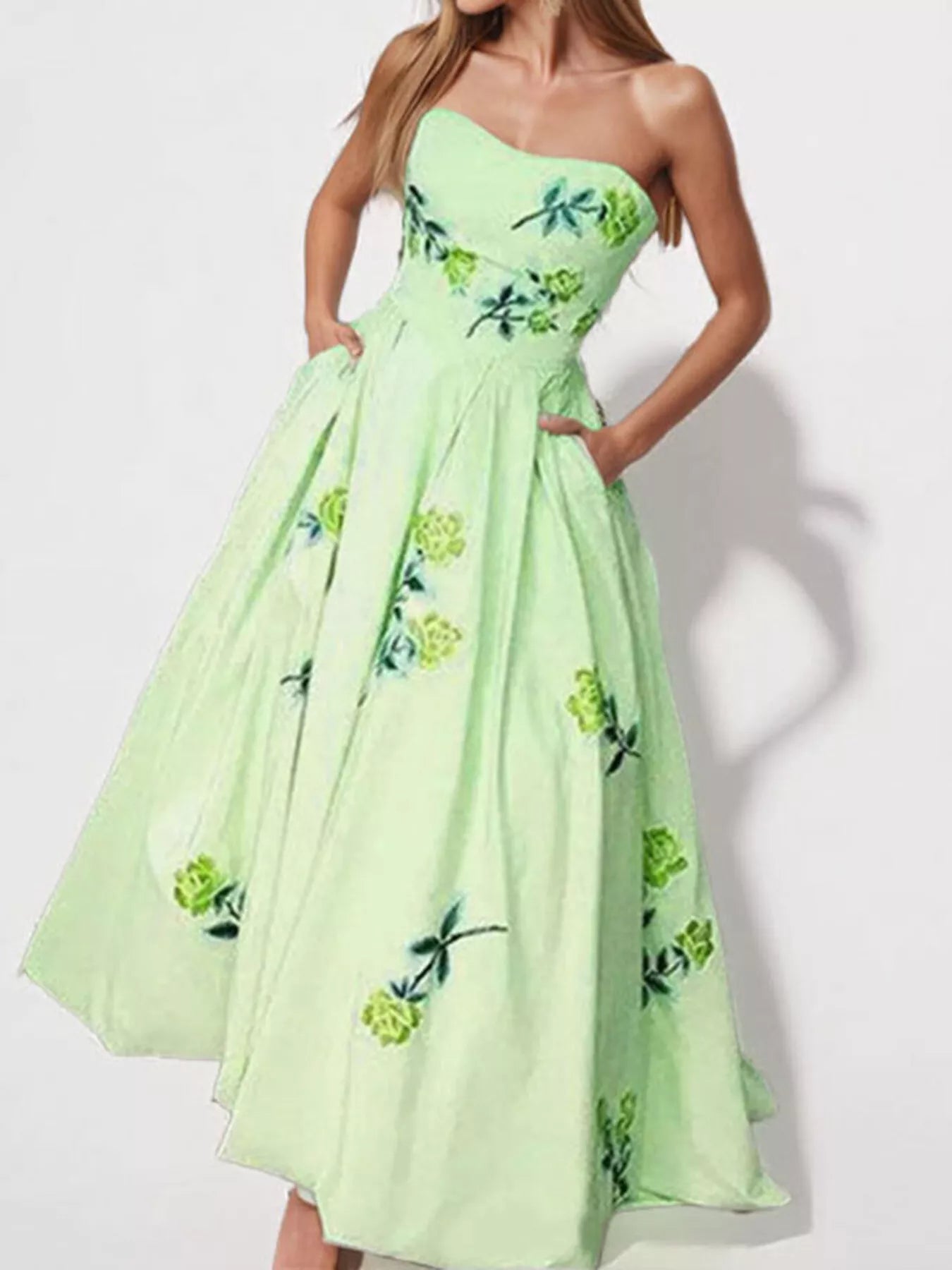 Floral print tube maxi dress from Trendsi featuring a fitted bodice, flowing skirt, and vibrant floral pattern.