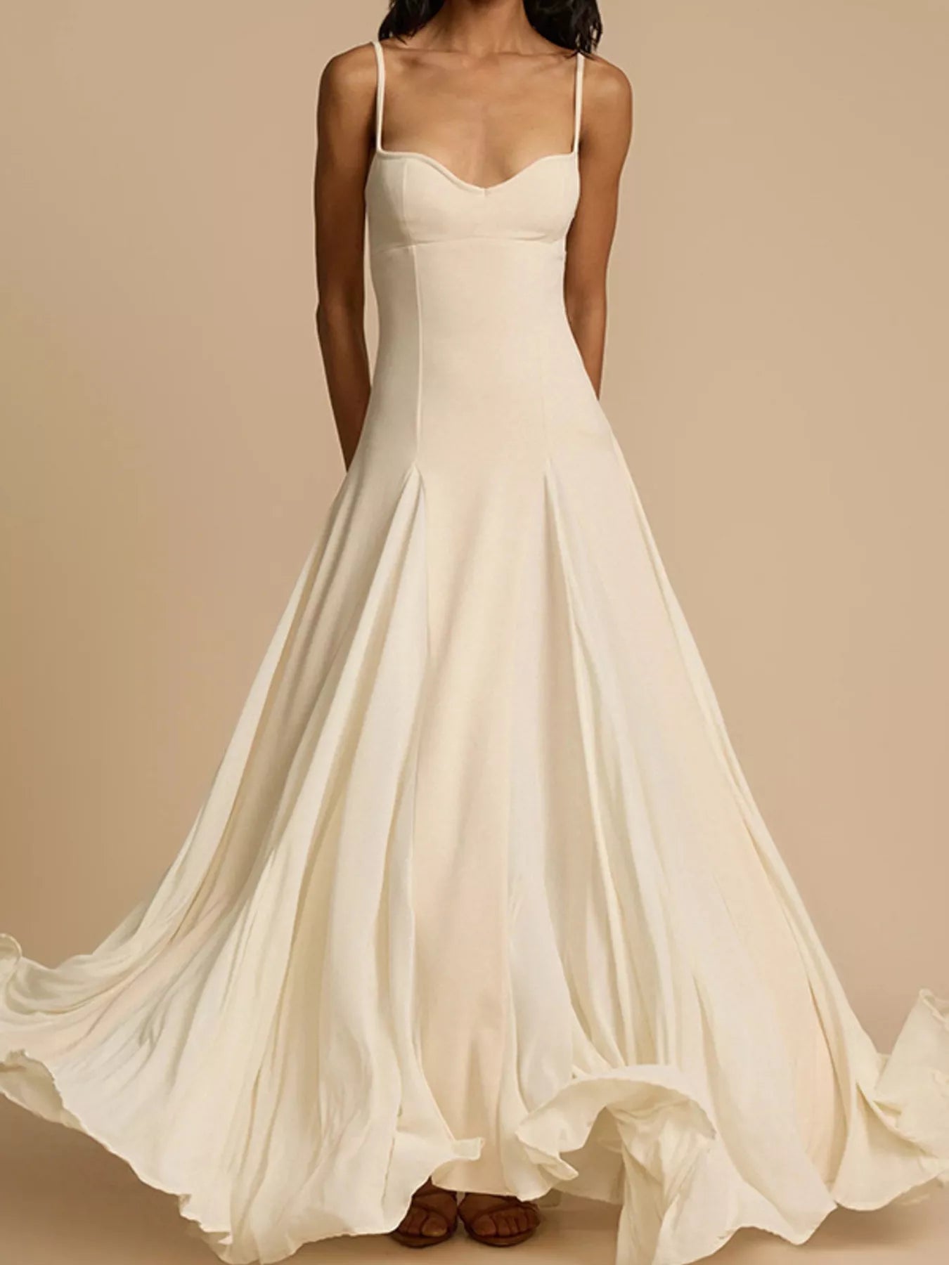 Flowy sweetheart neck spaghetti strap maxi dress by Trendsi, featuring a romantic design and lightweight fabric for summer wear.