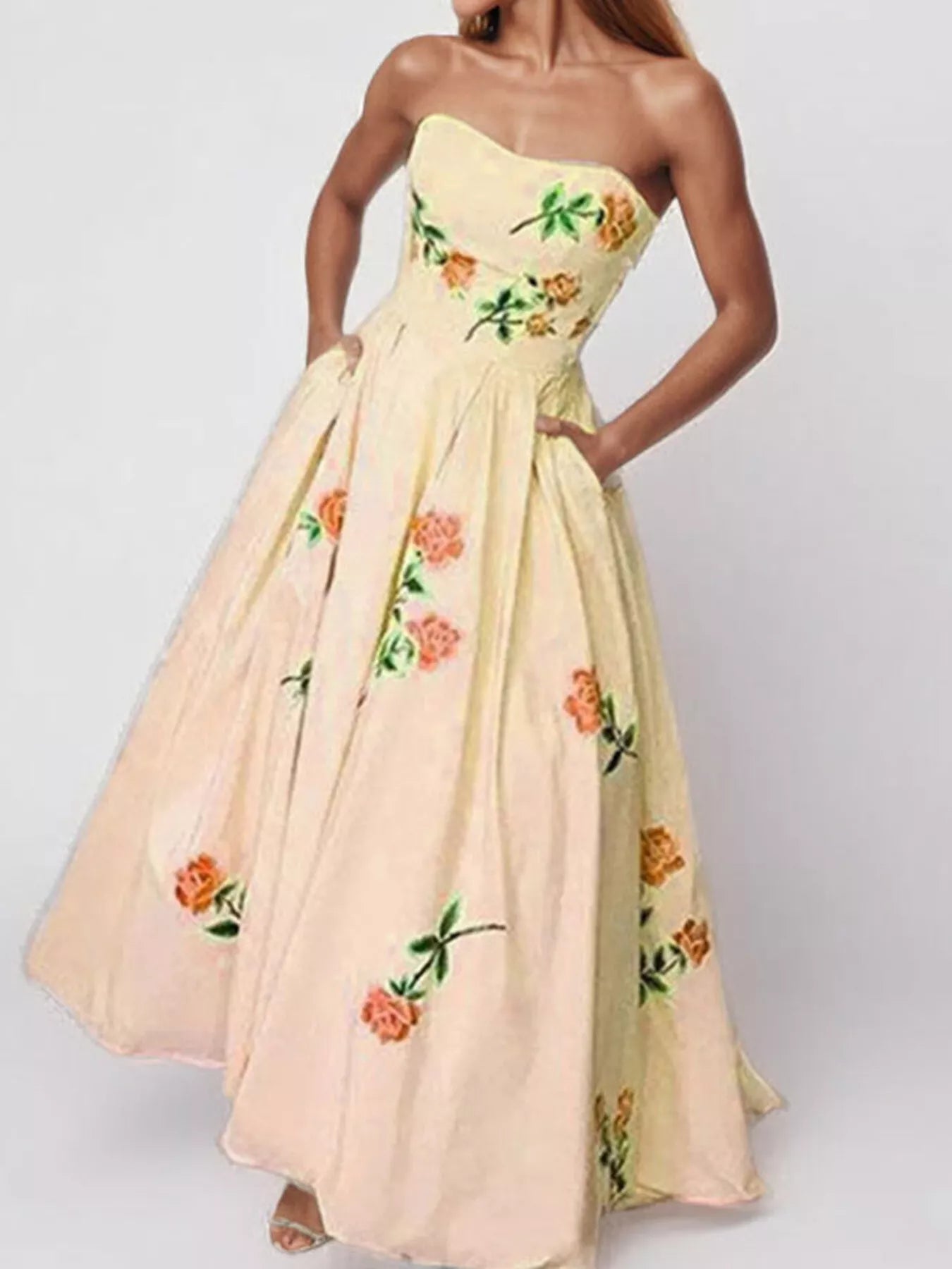 Floral print tube maxi dress from Trendsi featuring a fitted bodice and flowing skirt, perfect for summer or casual occasions.