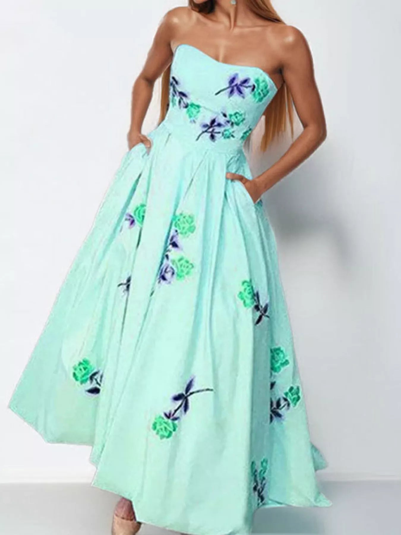 Floral print tube maxi dress by Trendsi featuring vibrant flower patterns and a fitted bodice with flowing skirt.