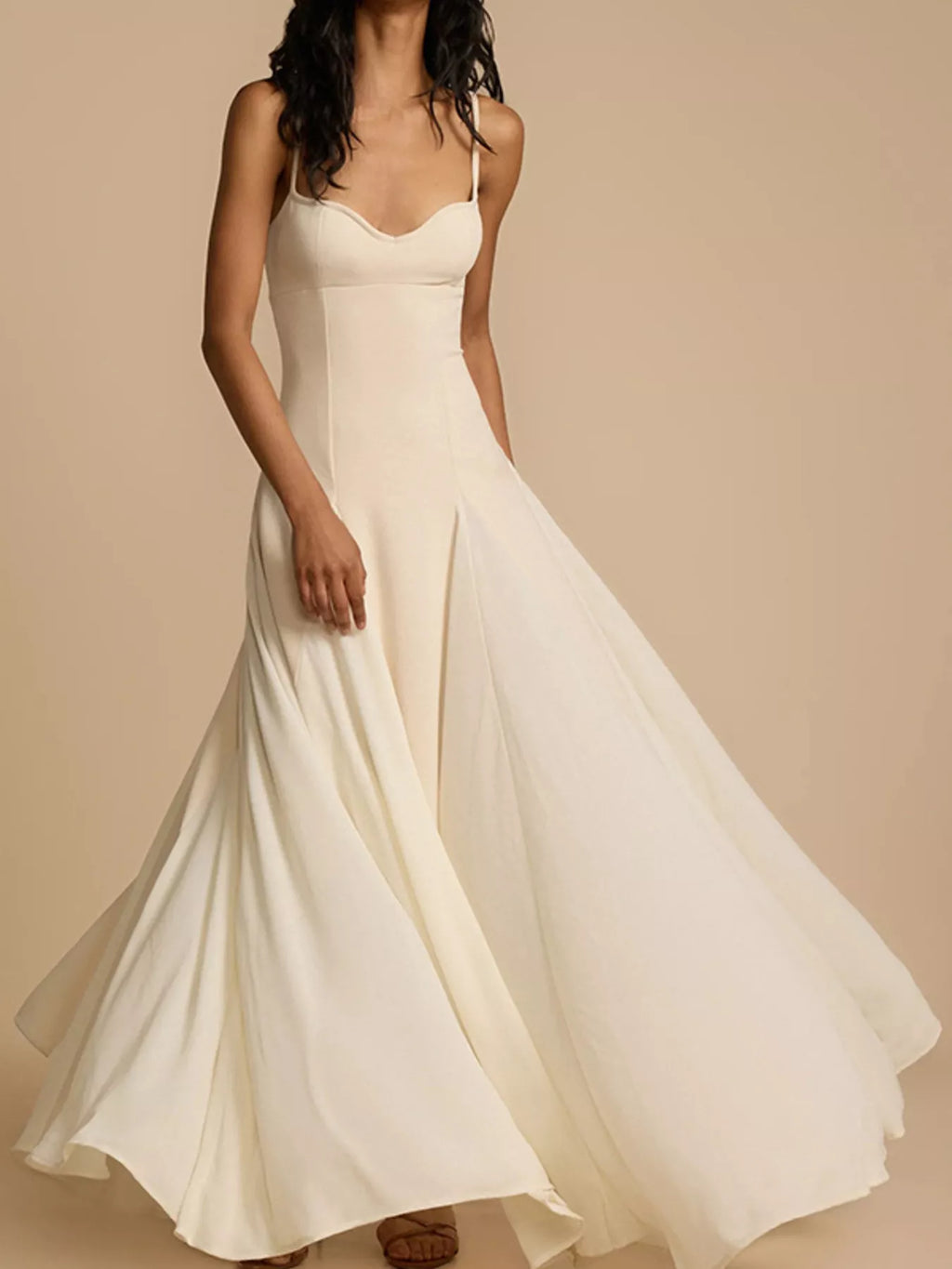 Flowy maxi dress with sweetheart neckline and spaghetti straps by Trendsi, featuring a lightweight, elegant design perfect for summer.