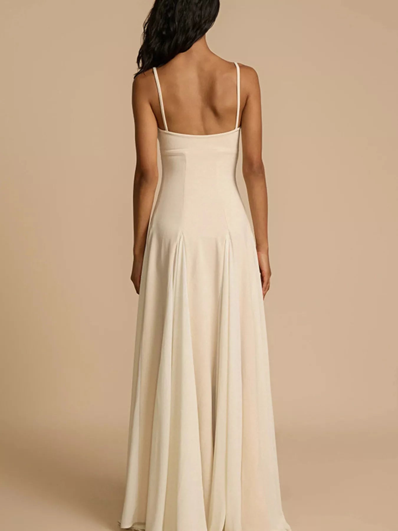 Flowy sweetheart neckline maxi dress with spaghetti straps in soft fabric, perfect for elegant summer occasions.